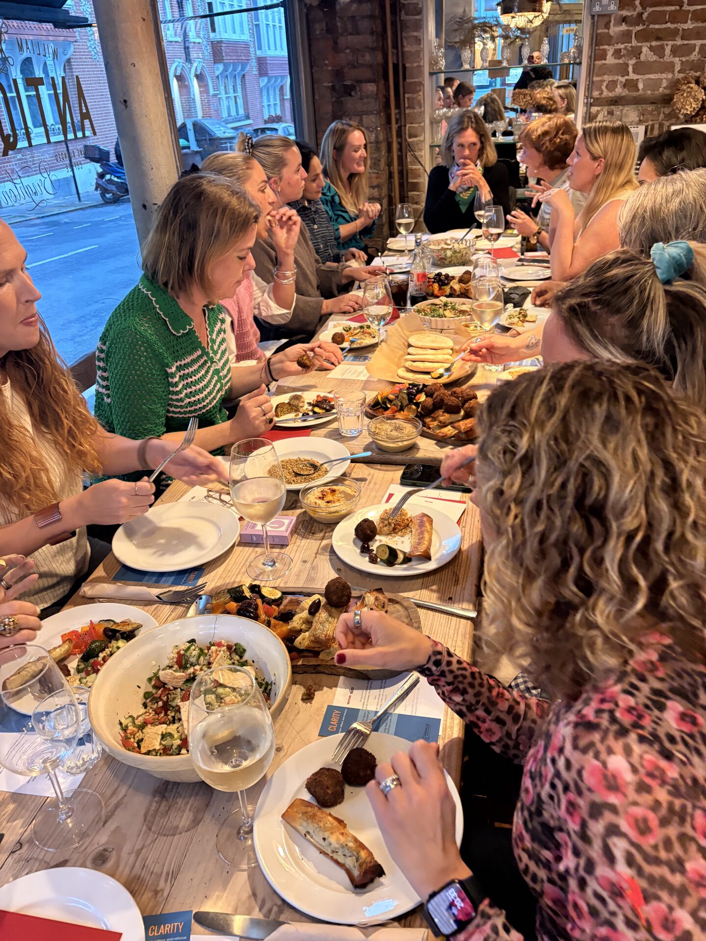 Guests sharing a meal at a long table